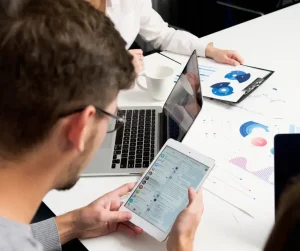 People using various devices to scroll through social media platforms, treating them like search engines in 2025.