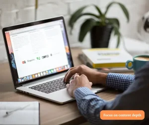 Content Depth in SEO – Person typing on a laptop, emphasizing in-depth content for SEO and E-E-A-T.